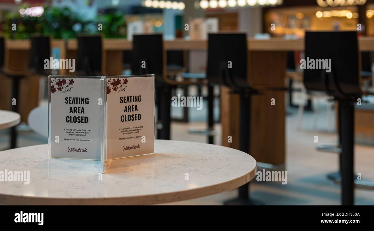 The sign sitting area closed off due to corona virus lockdown measures on the table in the food court restaurant. Langley BC, Canada-November 17,2020. Stock Photo