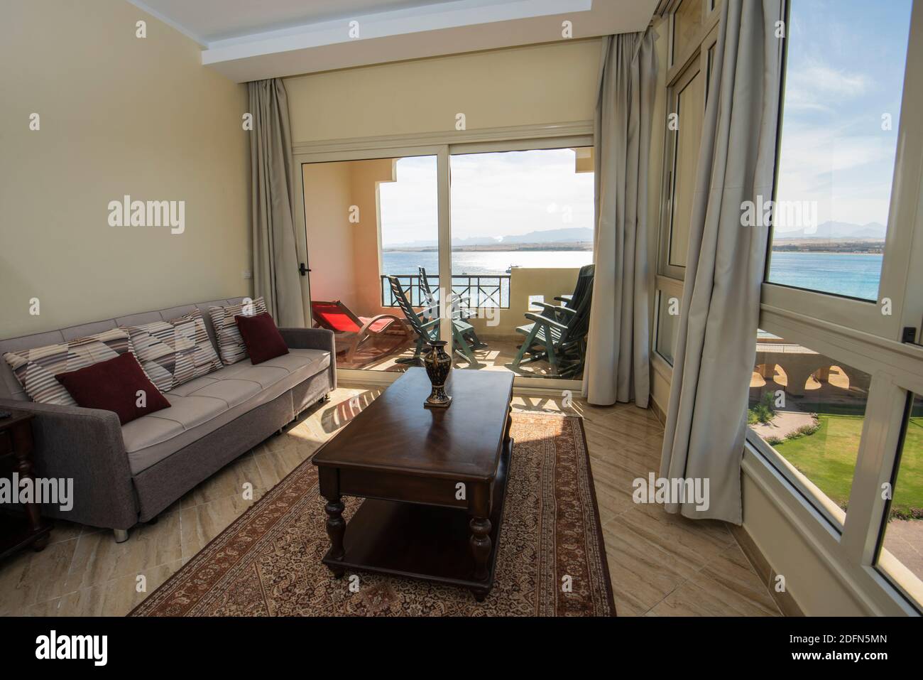 View of Living room lounge area in luxury apartment show home showing interior ...