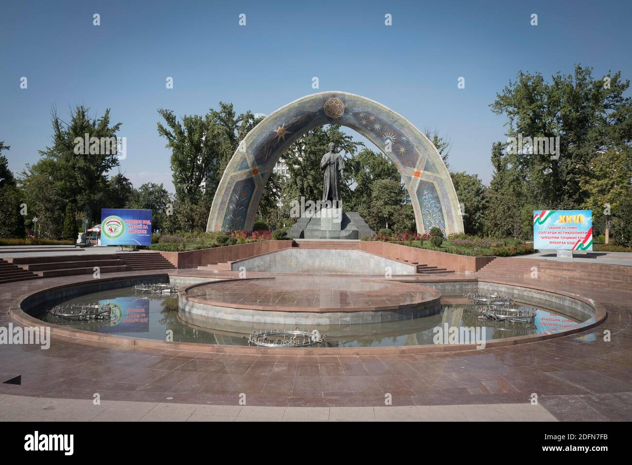 Fountain with Rudaki Monument to the Persian poet Rudaki of the same name, life data 859-940 AD, Rudaki Park, Dushanbe, Tajikistan Stock Photo