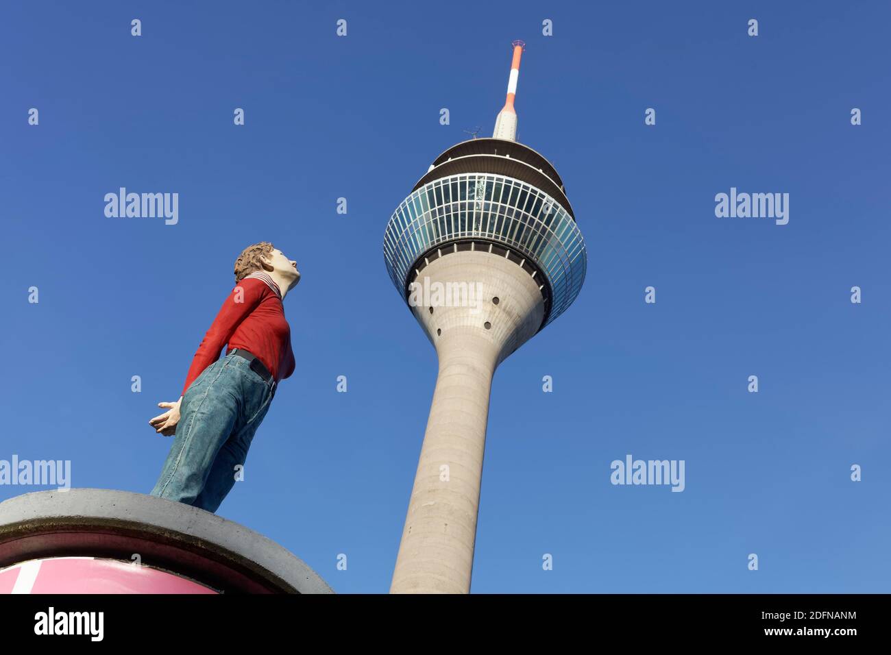 Realistic female figure on an advertising pillar in front of the Rhine Tower, column saint Marlis, sculpture by Christoph Poeggeler, Media Harbour Stock Photo