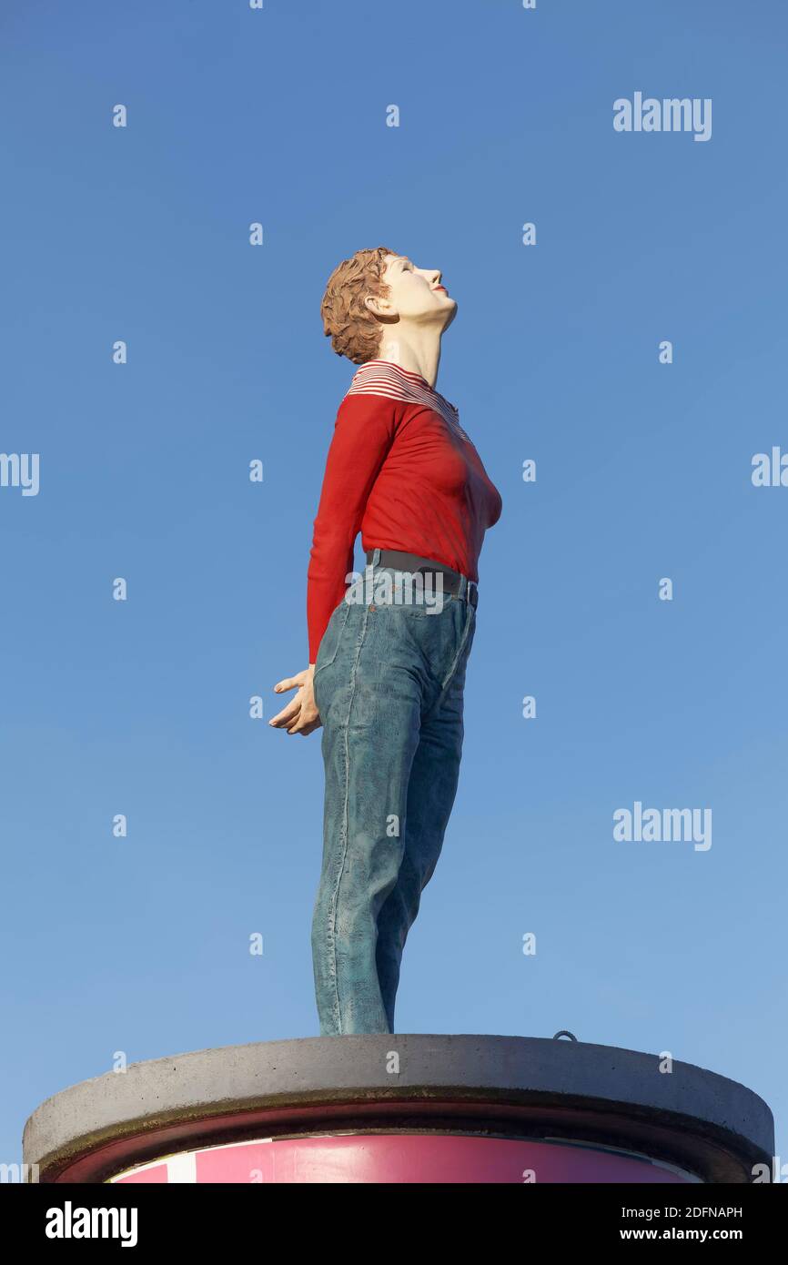 Realistic female figure on an advertising pillar, column saint Marlis, sculpture by Christoph Poeggeler, Media Harbour Duesseldorf, North Stock Photo