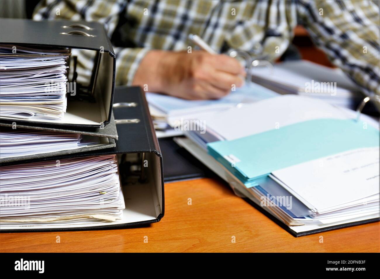 person writing on a notebook Stock Photo