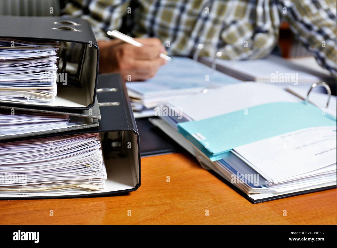person writing on a notebook Stock Photo