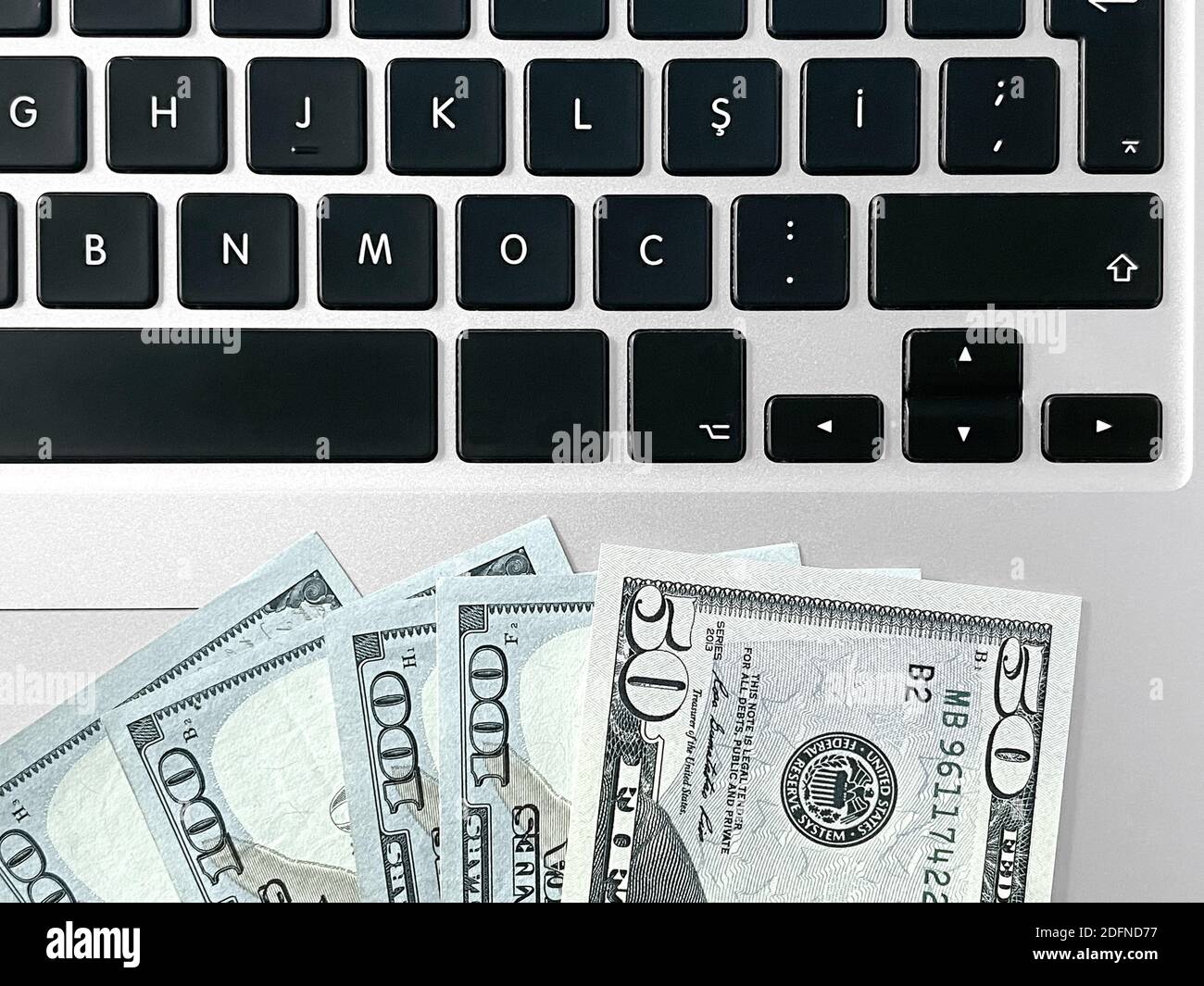 Money on laptop Stock Photo