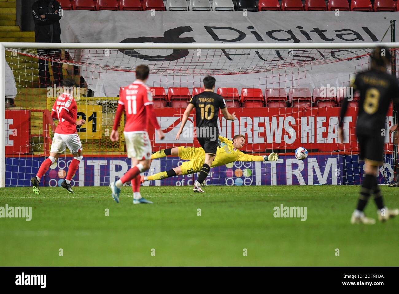 Ben Amos 13 of Charlton Athletic drives to his left to make a save