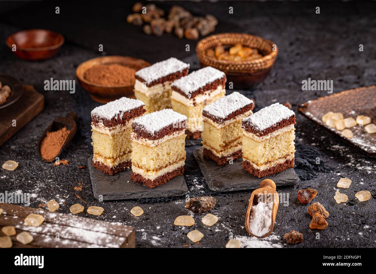 Still life of homemade small bites cakes on black slate Stock Photo