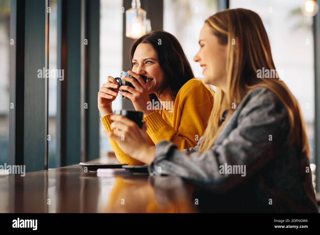 Two women in cafe having a drink hi-res stock photography and images ...