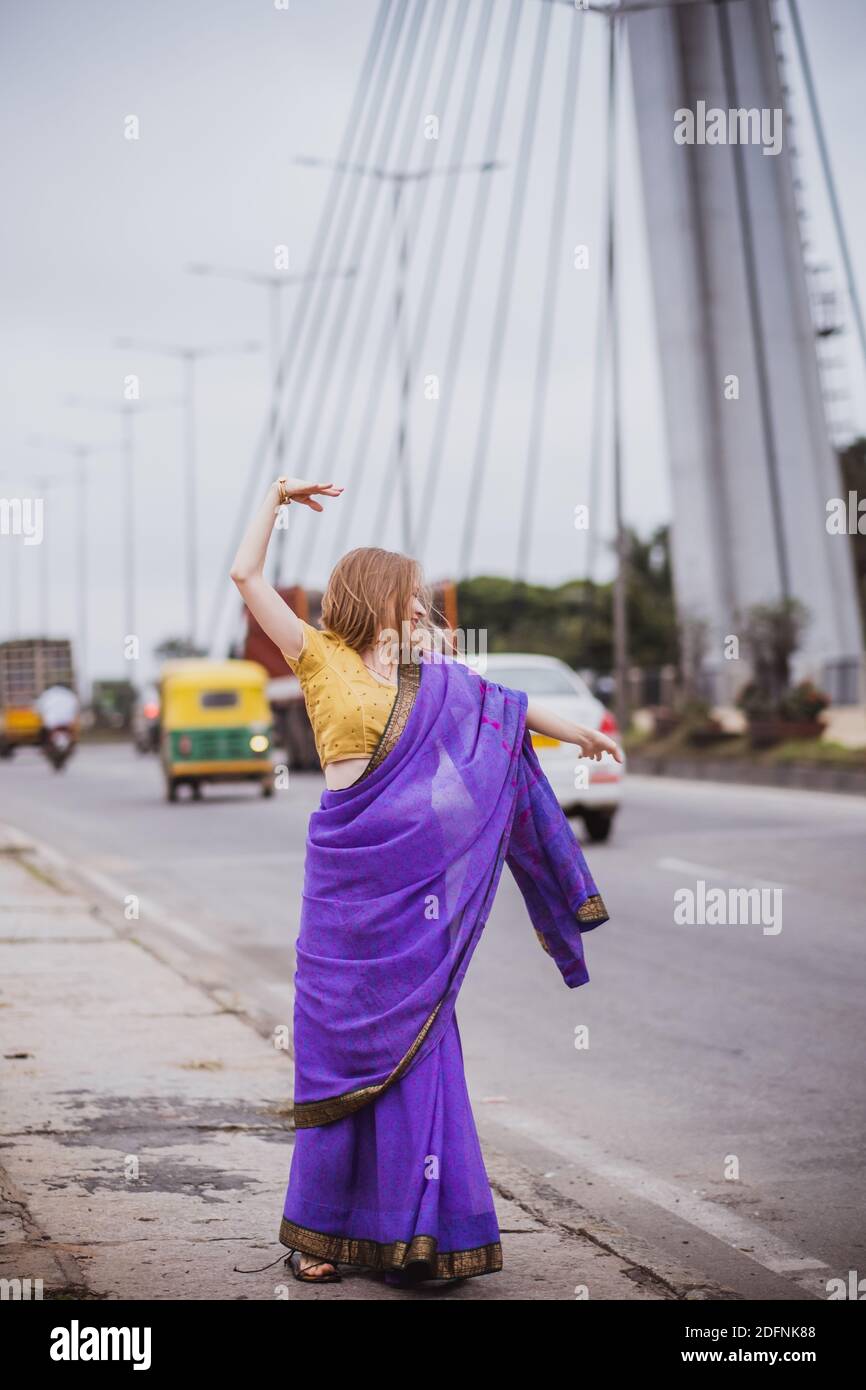 Young european woman with short hair in purple traditional saree. Outdoor  portrait in soft sunlight. India, Bangalore Stock Photo - Alamy