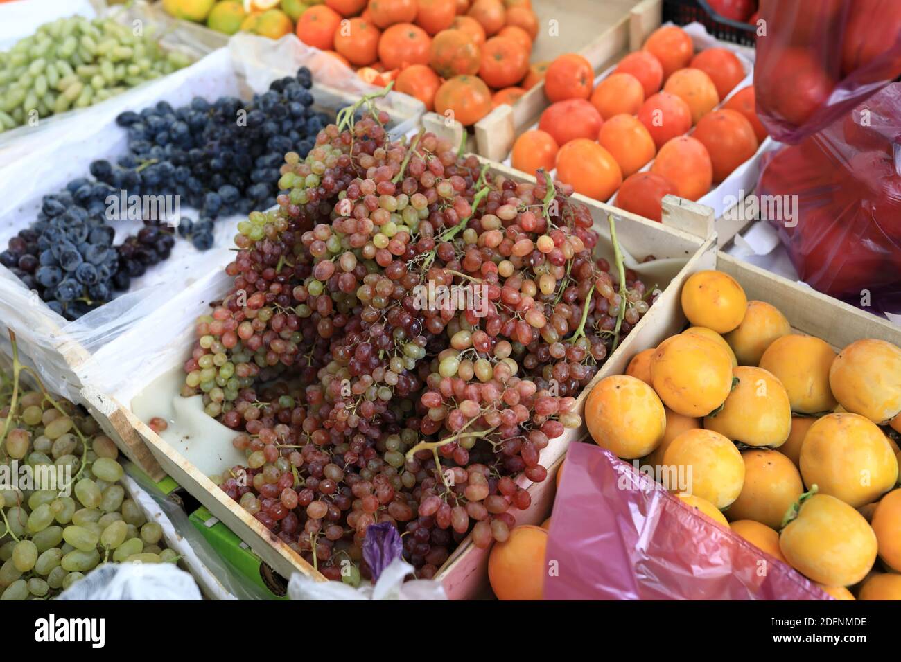 Various fruits in boxes on the market Stock Photo - Alamy