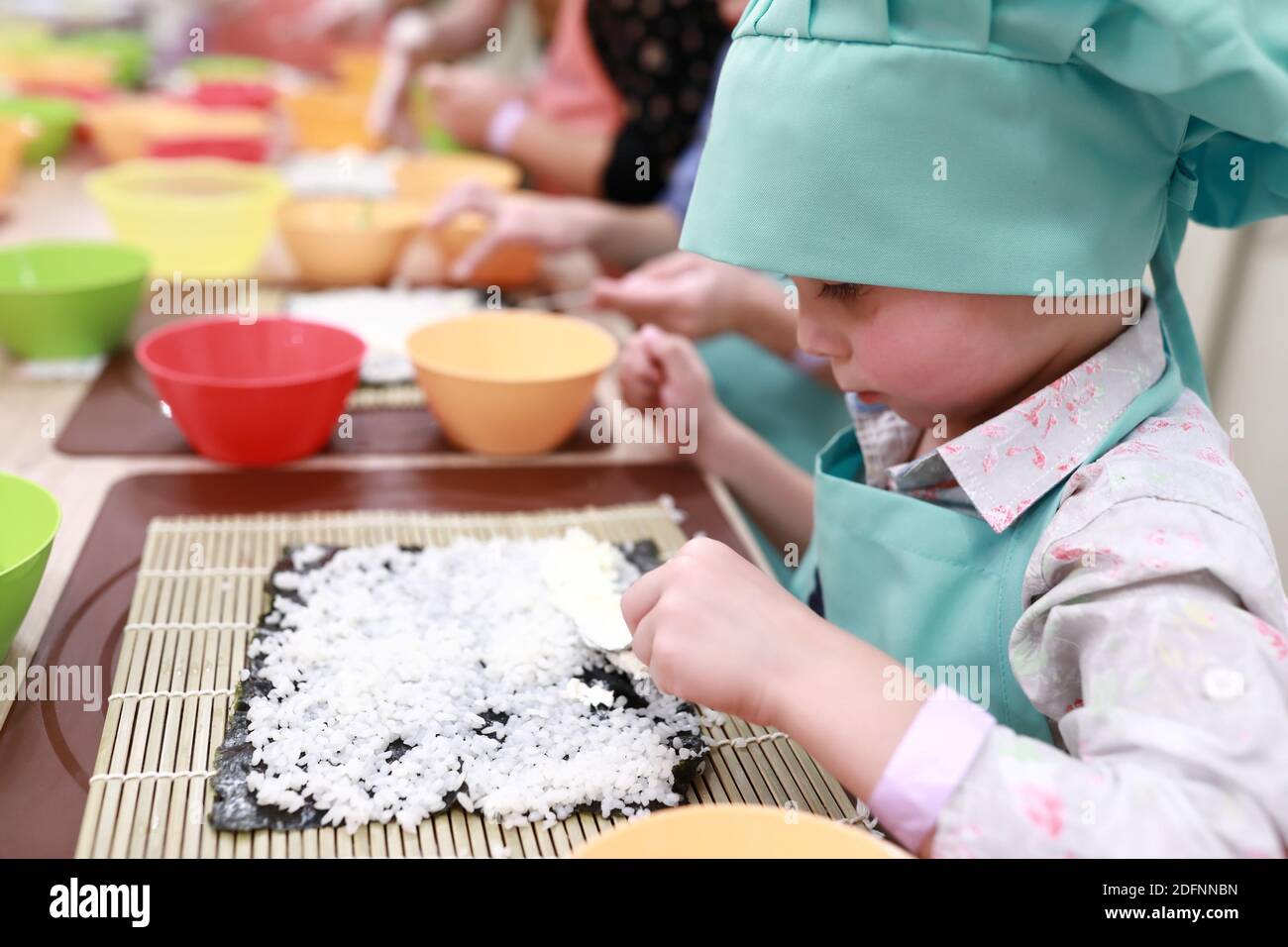 Child is making sushi at cooking class Stock Photo - Alamy