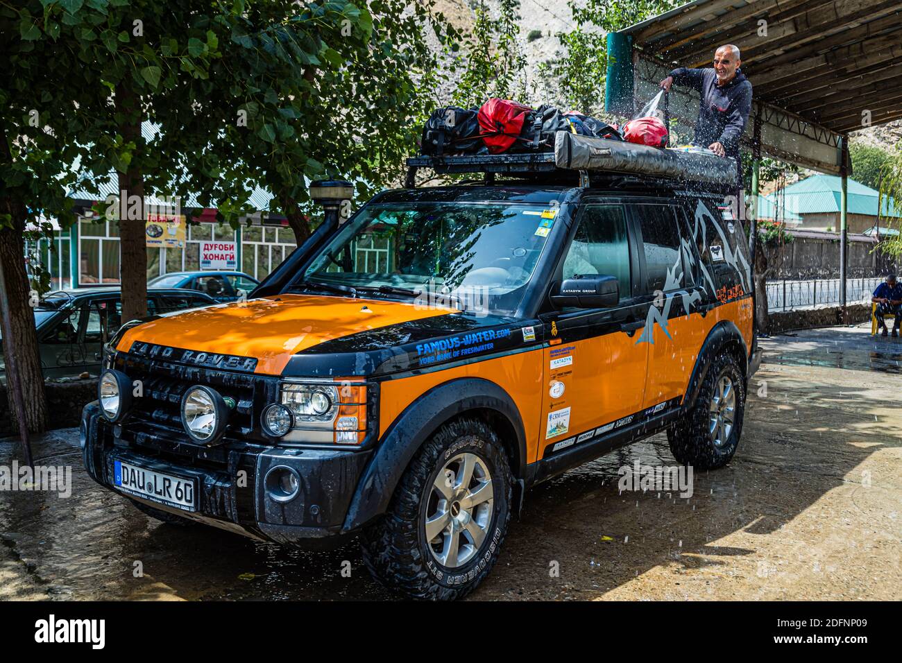 Cleaning Cars near Varzob District, Tajikistan Stock Photo