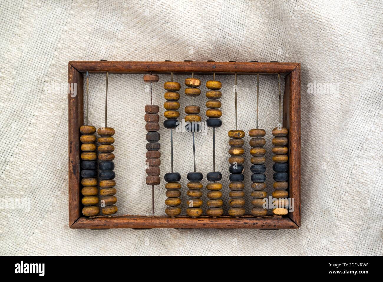 Frame of wooden abacus on canvas surface. Stock Photo