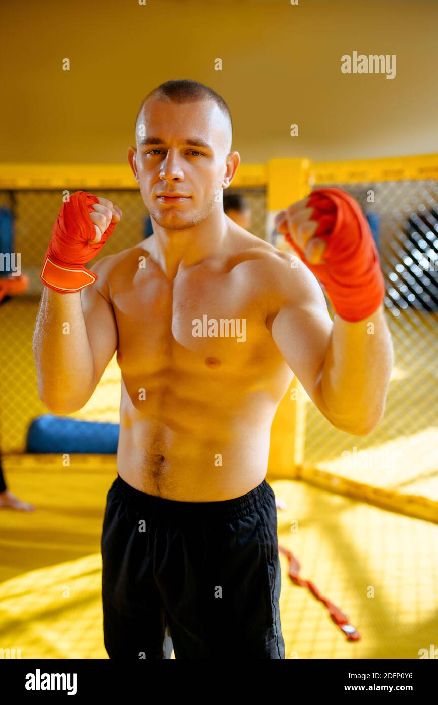 Male MMA fighter with red bandages on his hands Stock Photo