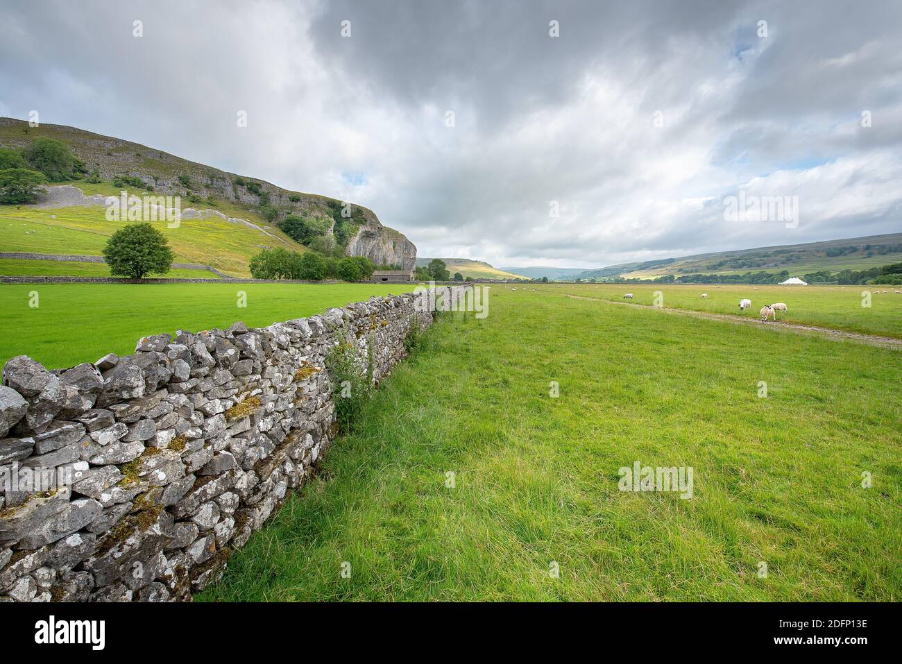 Cotterdale, Yorkshire Dales National Park, York, England - A view of some old stone barns, sheep and the rolling landscape of the Yorkshire Dales. Stock Photo