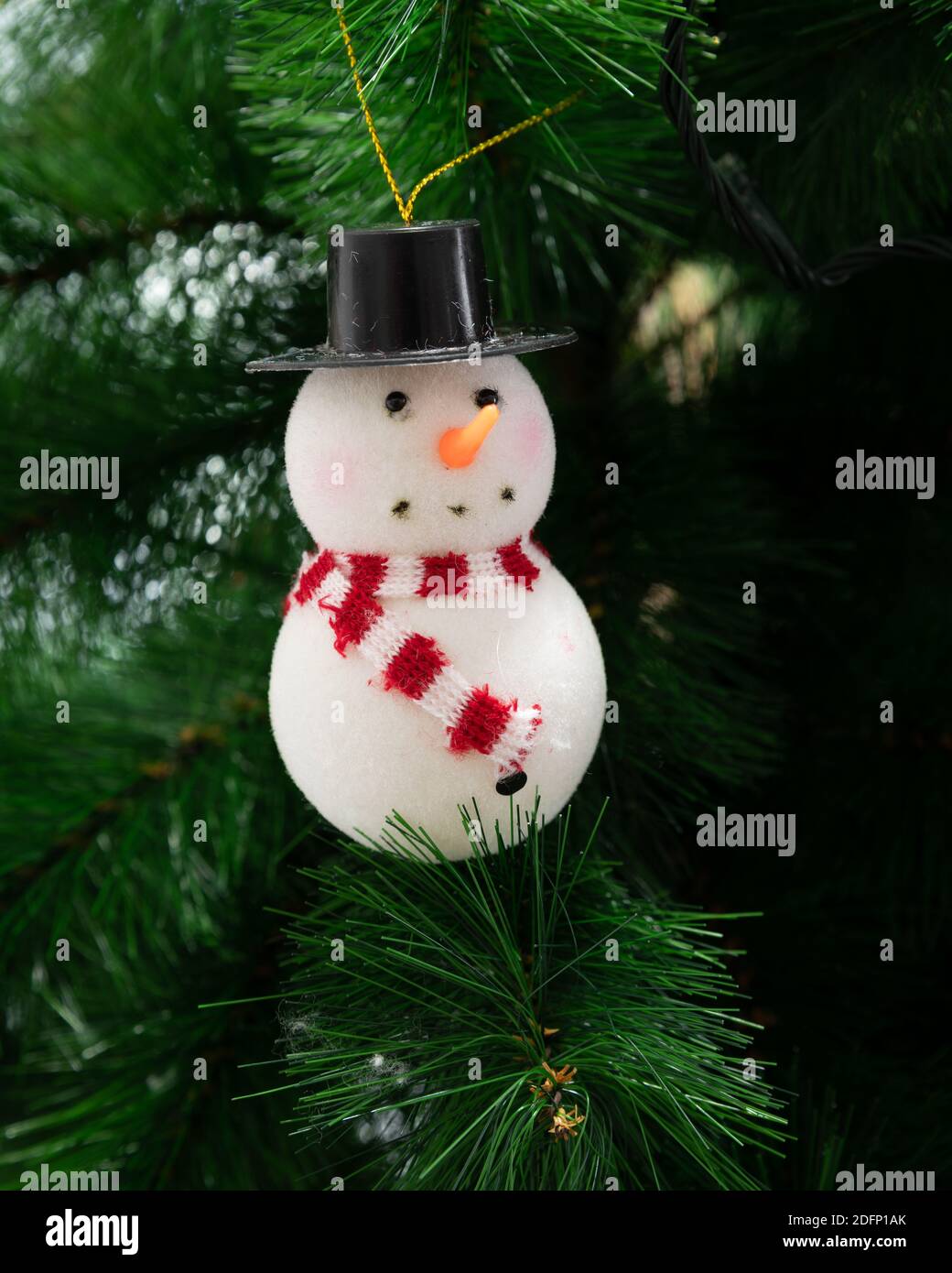 A beautiful snowman tree hanging, adorning a Christmas tree. Stock Photo