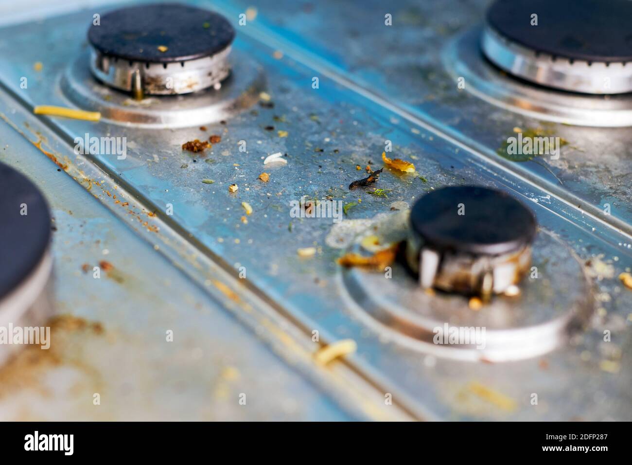 Dirty stove top with oil splatters, fat stains and food leftovers