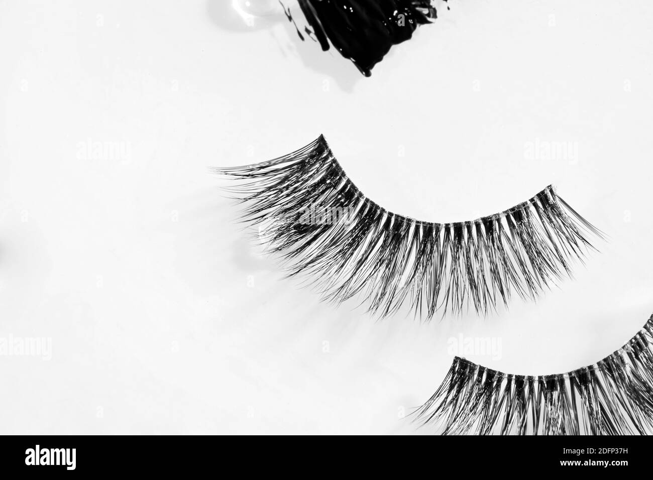 Artificial Eyelashes with paint on white background Stock Photo