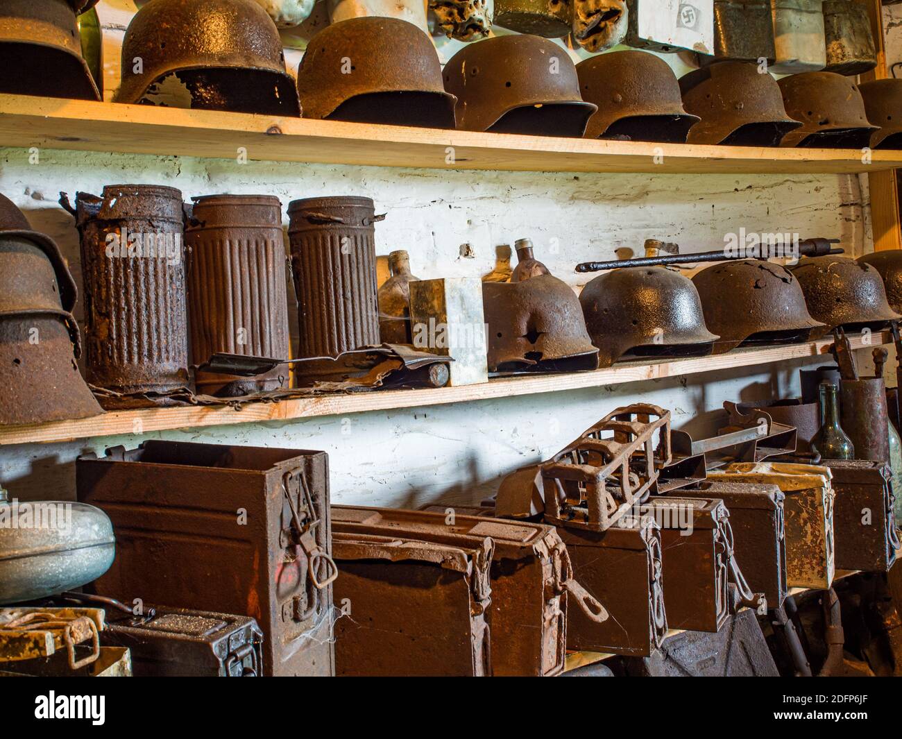 Zyndranowa, Poland - August 13, 2017: Collection of old metal helmets, vessels and other war accessories at the Lemko culture museum Stock Photo