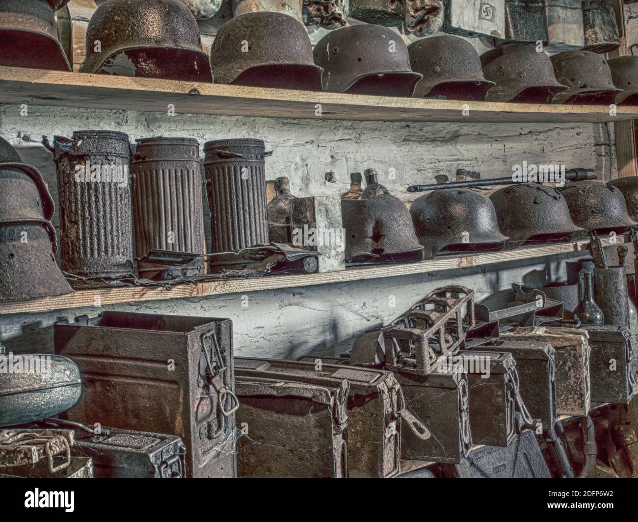 Zyndranowa, Poland - August 13, 2017: Collection of old metal helmets, vessels and other war accessories at the Lemko culture museum. Vintage photo. Stock Photo