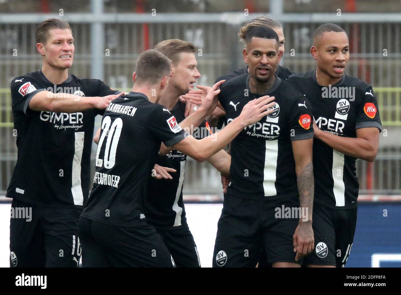 06 December 2020, Bavaria, Würzburg: Football: 2nd Bundesliga, Würzburger Kickers - SV Sandhausen, 10th matchday, in the Flyeralarm Arena. Daniel Keita Ruel (2nd from right) from Sandhausen cheers with his teammates about his goal for the 0:1. Photo: Daniel Karmann/dpa - IMPORTANT NOTE: In accordance with the regulations of the DFL Deutsche Fußball Liga and the DFB Deutscher Fußball-Bund, it is prohibited to exploit or have exploited in the stadium and/or from the game taken photographs in the form of sequence images and/or video-like photo series. Stock Photo