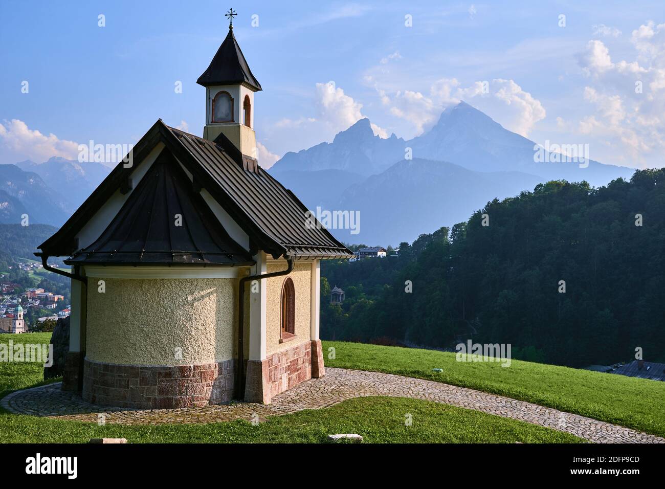 Small Kirchleitn chapel and alpine landscape with Watzmann mountain in the background in Berchtesgaden, Germany Stock Photo