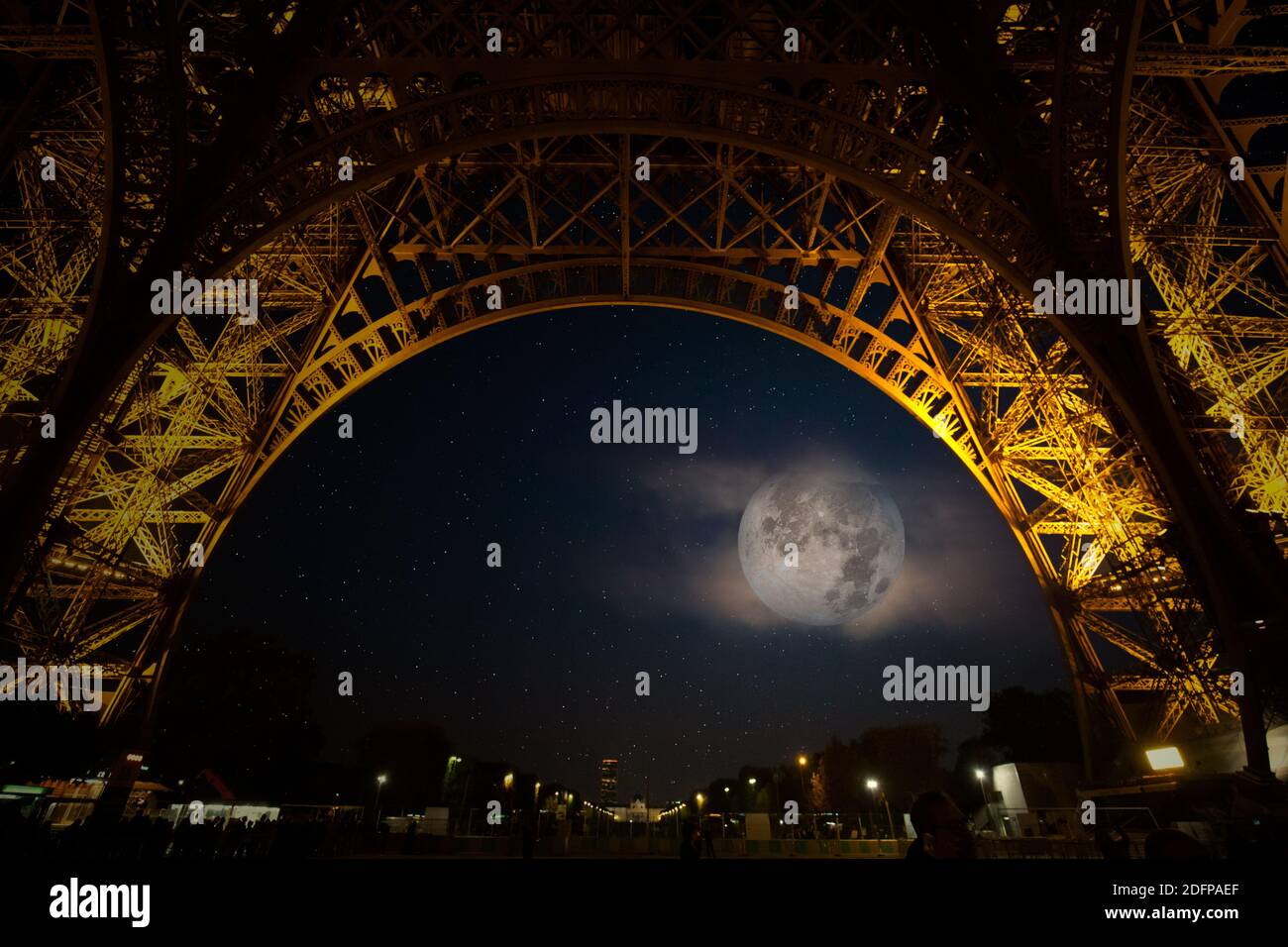 full moon under the Eiffel tower Stock Photo