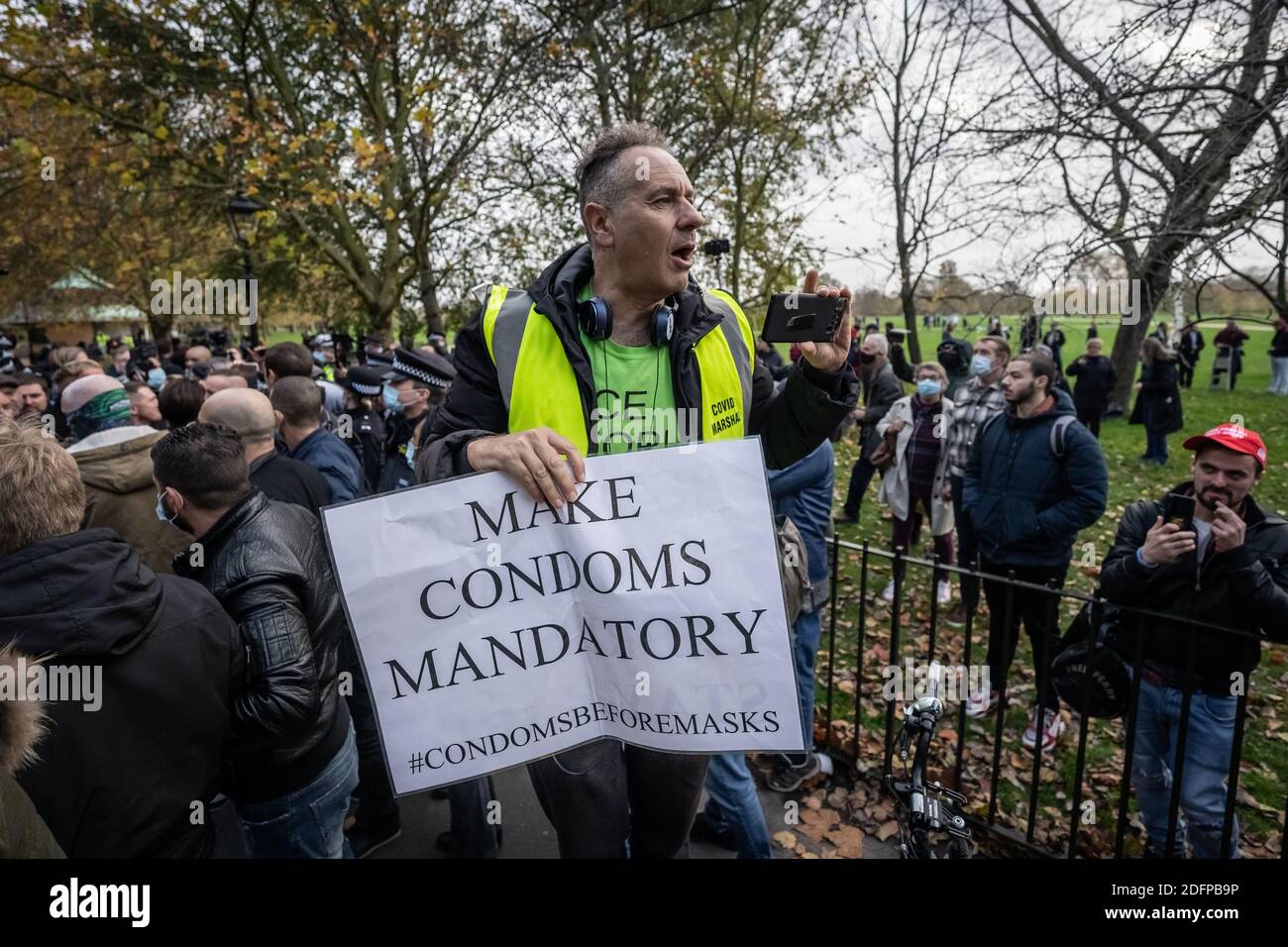 Danny Shine joins the crowds. Preaching, debates and sermons at Speakers’ Corner, the public speaking north-east corner of Hyde Park. London, UK. Stock Photo