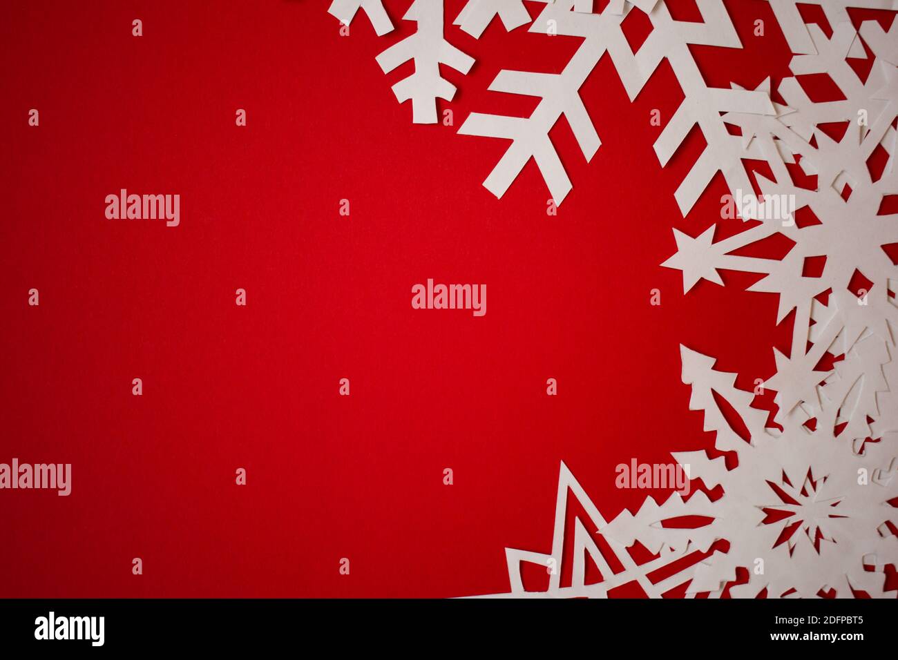 Red background with paper snowflakes. Christmas concept background Stock Photo