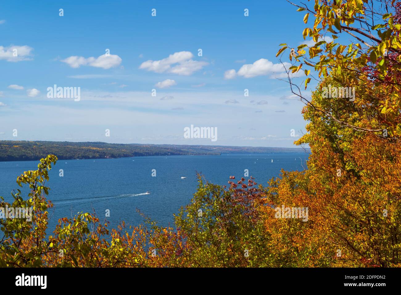 Watercraft navigate the waters of Cayuga Lake, which is one of the 