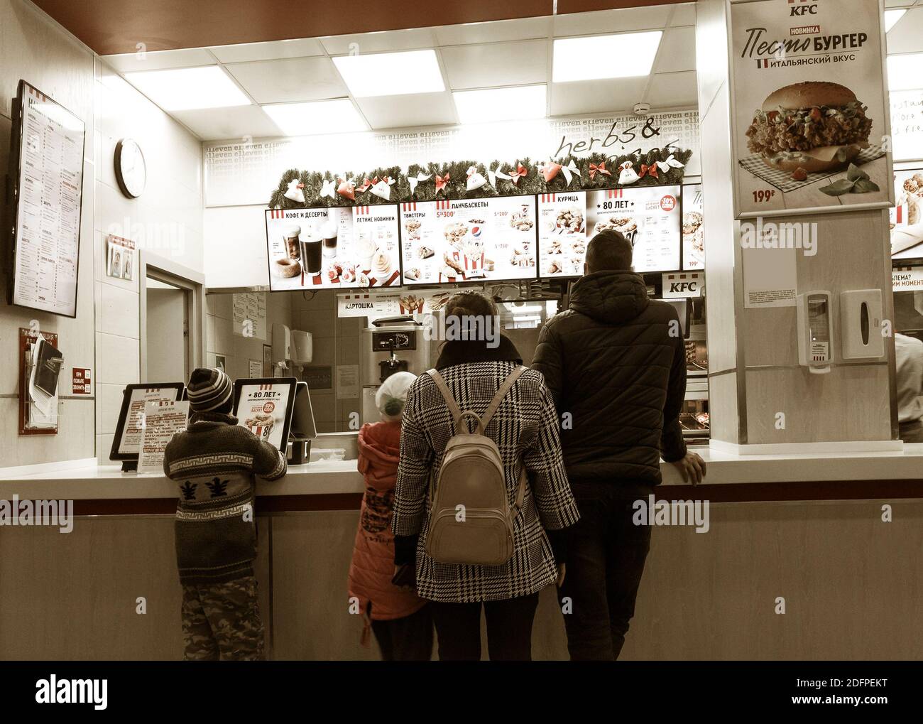 Russia, 2020 family stands in the Kentucky Fried Chicken (KFC) fast