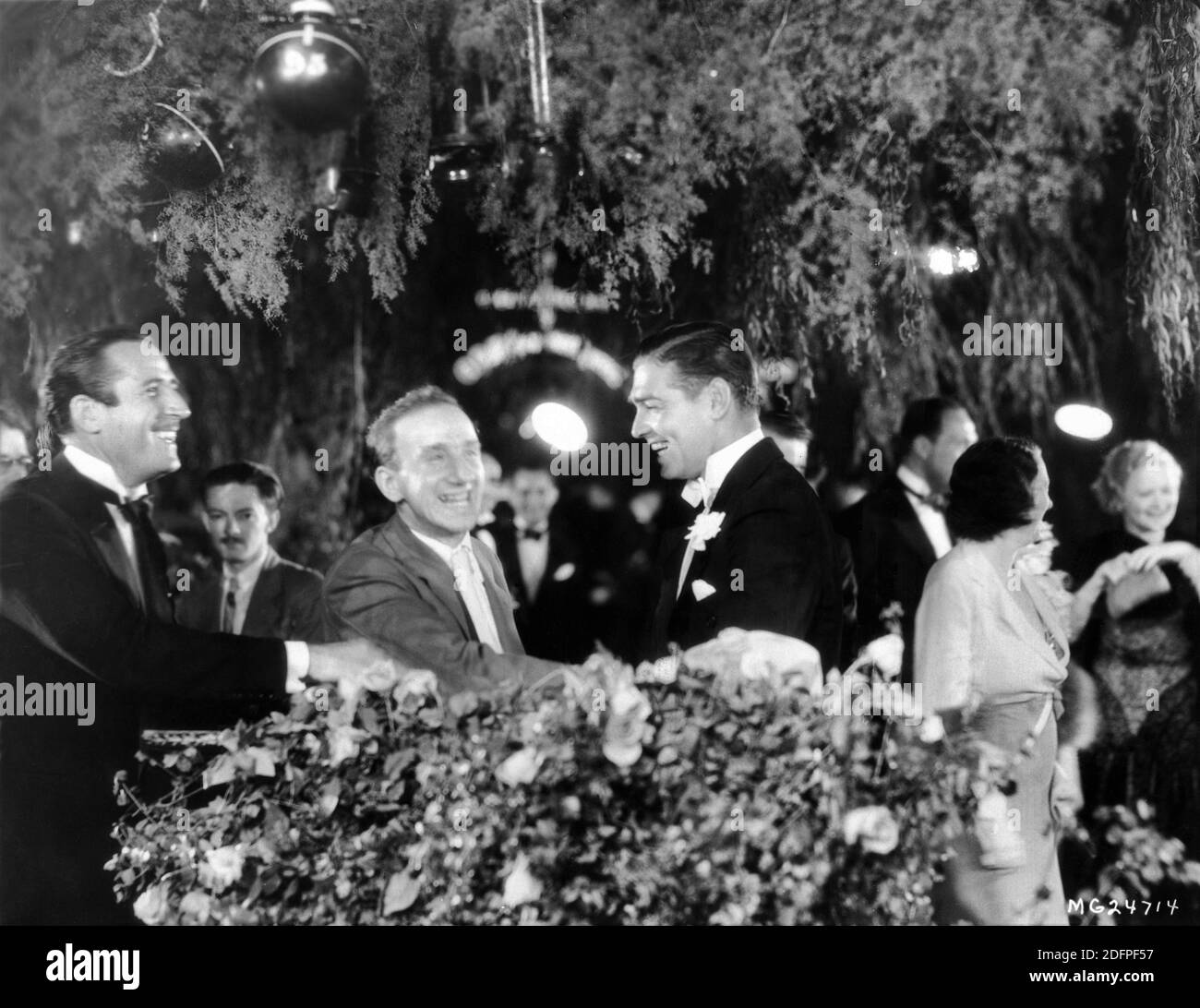 CLARK GABLE welcomed by Masters of Ceremonies JOHN MILJAN and JIMMY DURANTE at the Hollywood Premiere at Grauman's Chinese Theatre in Los Angeles on July 15th 1932 of his latest film STRANGE INTERLUDE 1932 director ROBERT Z. LEONARD from the play by Eugene O'Neill Metro Goldwyn Mayer Stock Photo