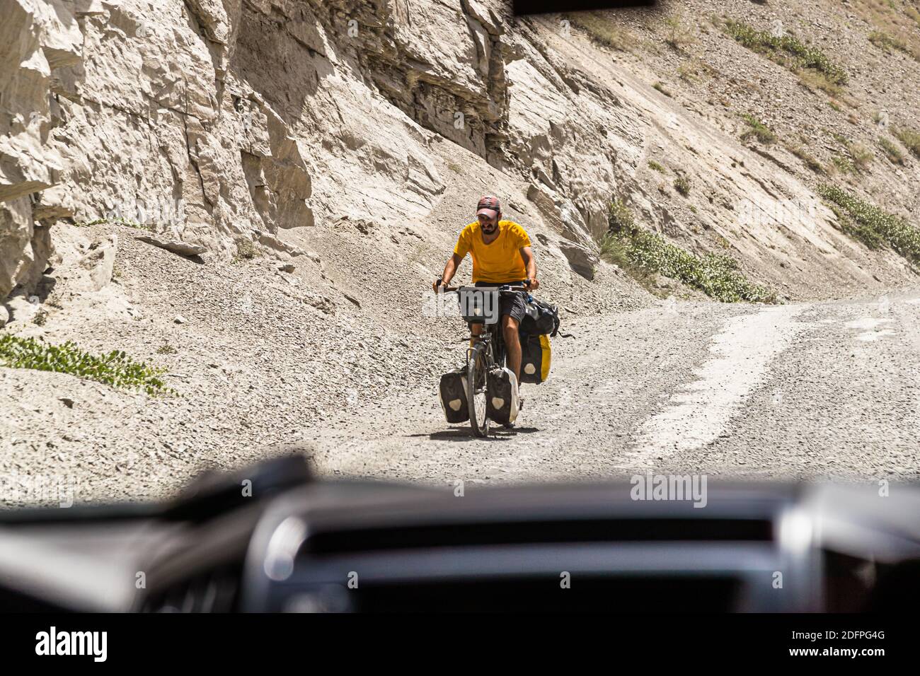Cyclist on Silk Road near Khekhik, Tajikistan Stock Photo