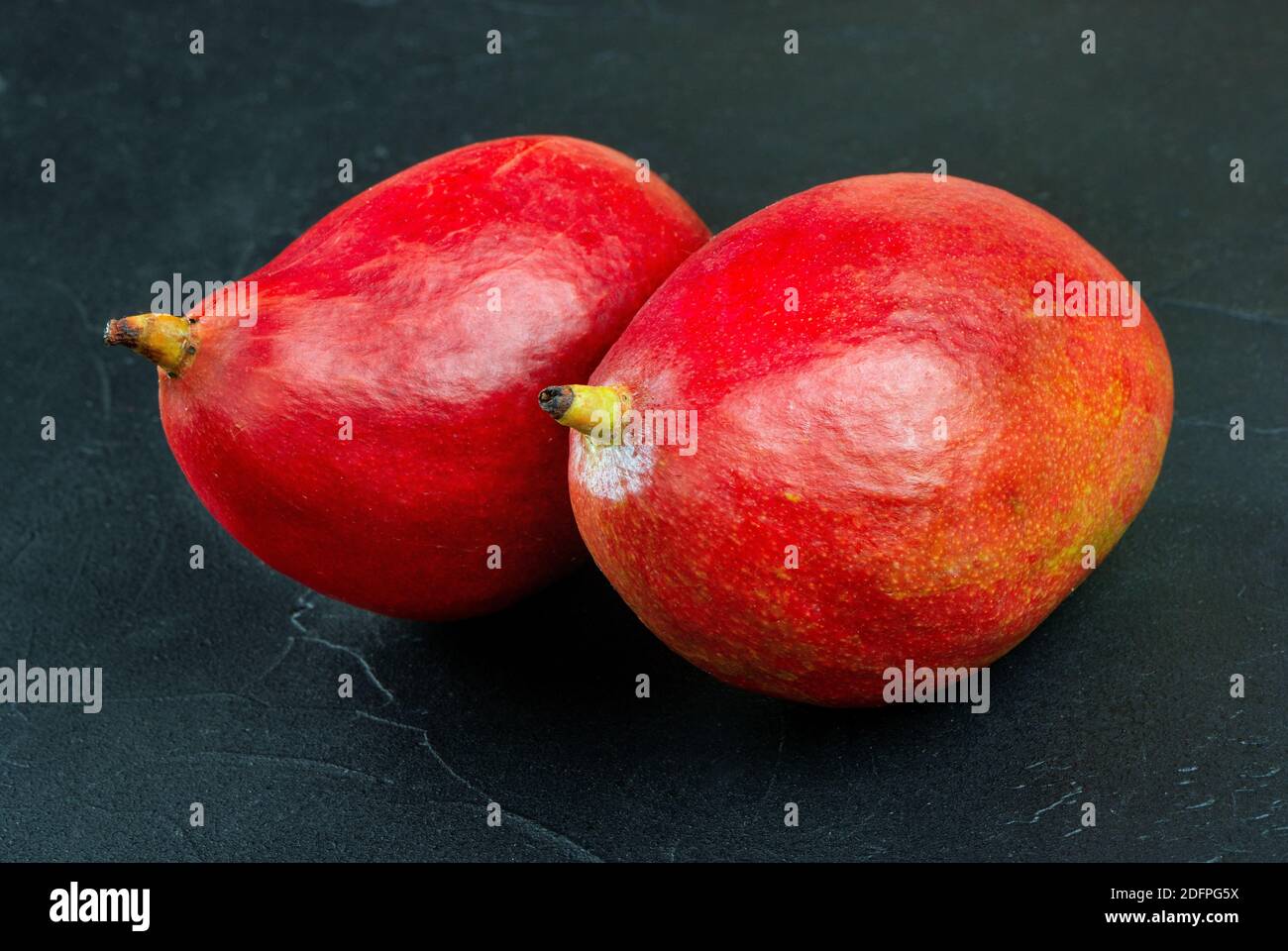 Two red mango fruits hi-res stock photography and images - Alamy