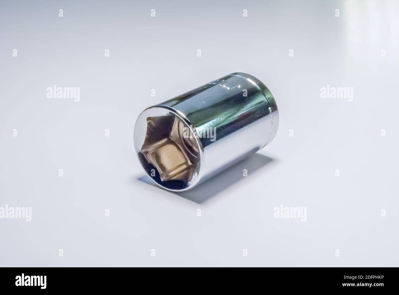 A closeup of metal ratchet socket on white background metal ratchet ...