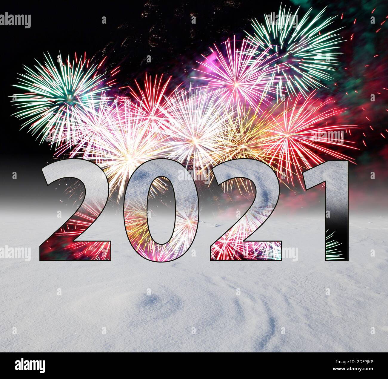 NEW YEAR 2021 IN BIG NUMBERS, ON A BACKGROUND OF SNOW AND SALUTE Stock Photo