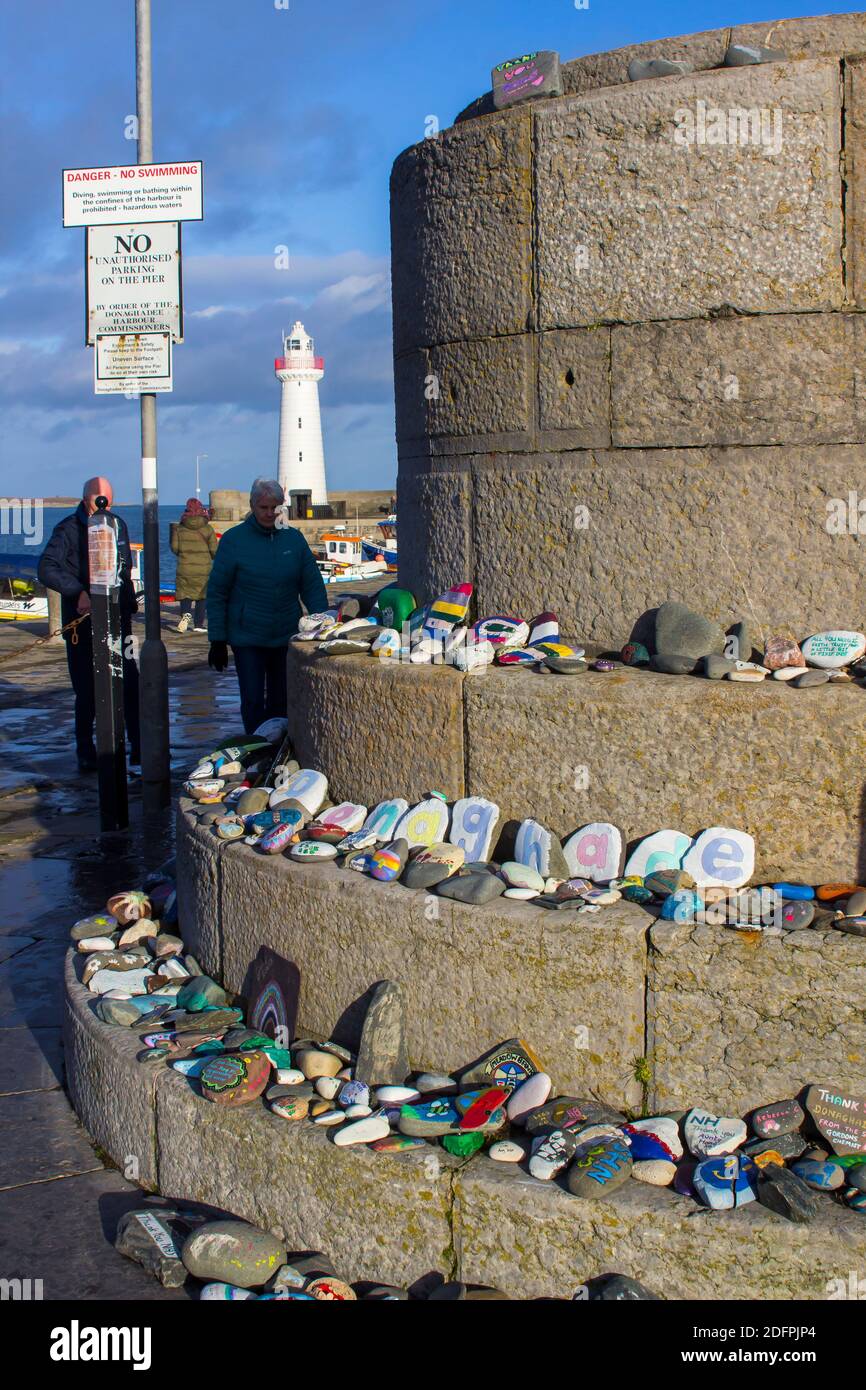 2 December 2020 Messages of hope and love painted on rocks and laid on the wall of the harbour in the picturesque village of donaghadee Northern Irela Stock Photo
