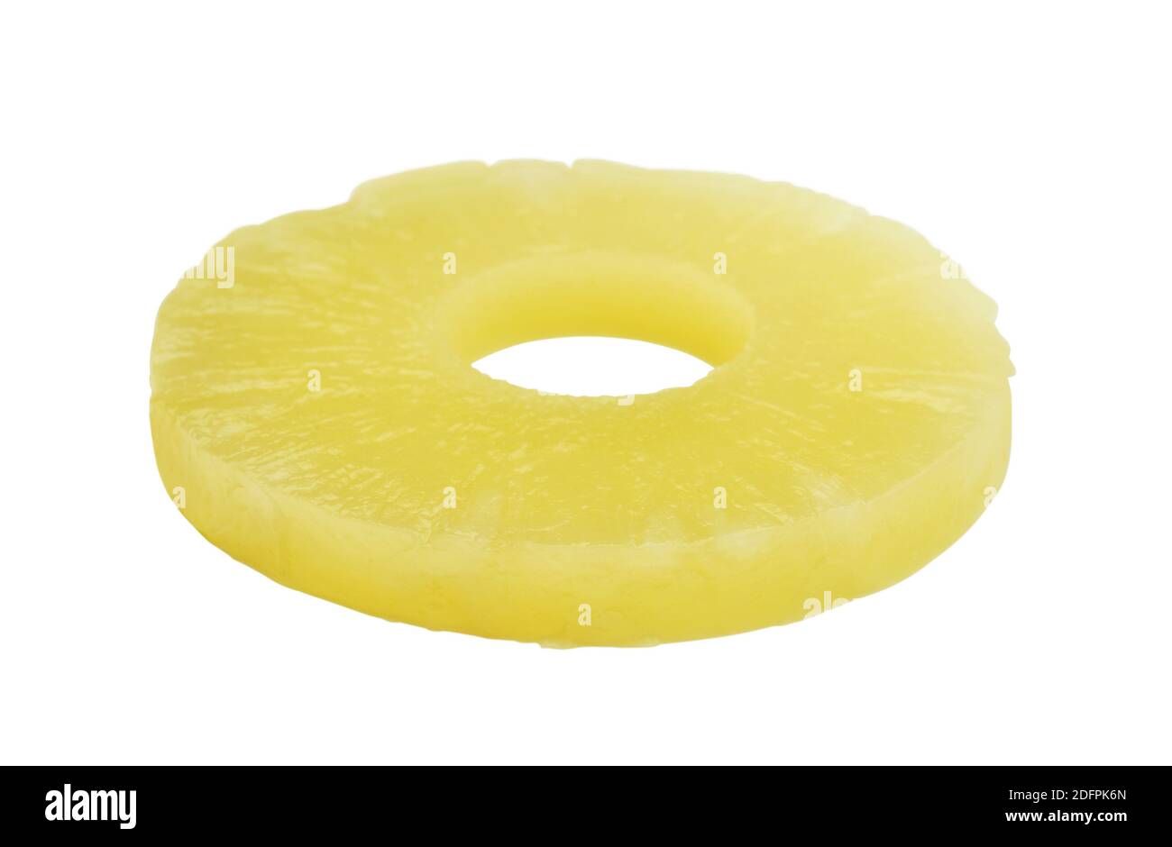 Ripe tinned pineapple ring isolated on white. Side view. Stock Photo