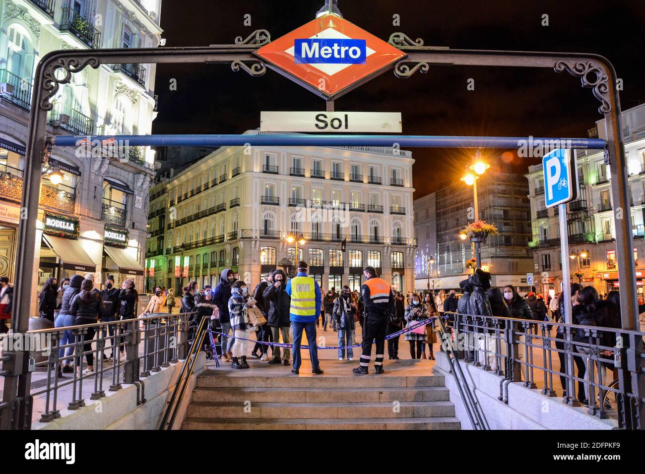 Madrid Metro operators monitor the access to Puerta del Sol Station, closed by excess of people in the central Puerta del Sol square in the capital of Spain.Restriction measures for access to Plaza de la Puerta del Sol in Madrid. The Madrid government has made the decision to monitor access to the busy Puerta del Sol square in Madrid after the covid-19 health crisis. Stock Photo