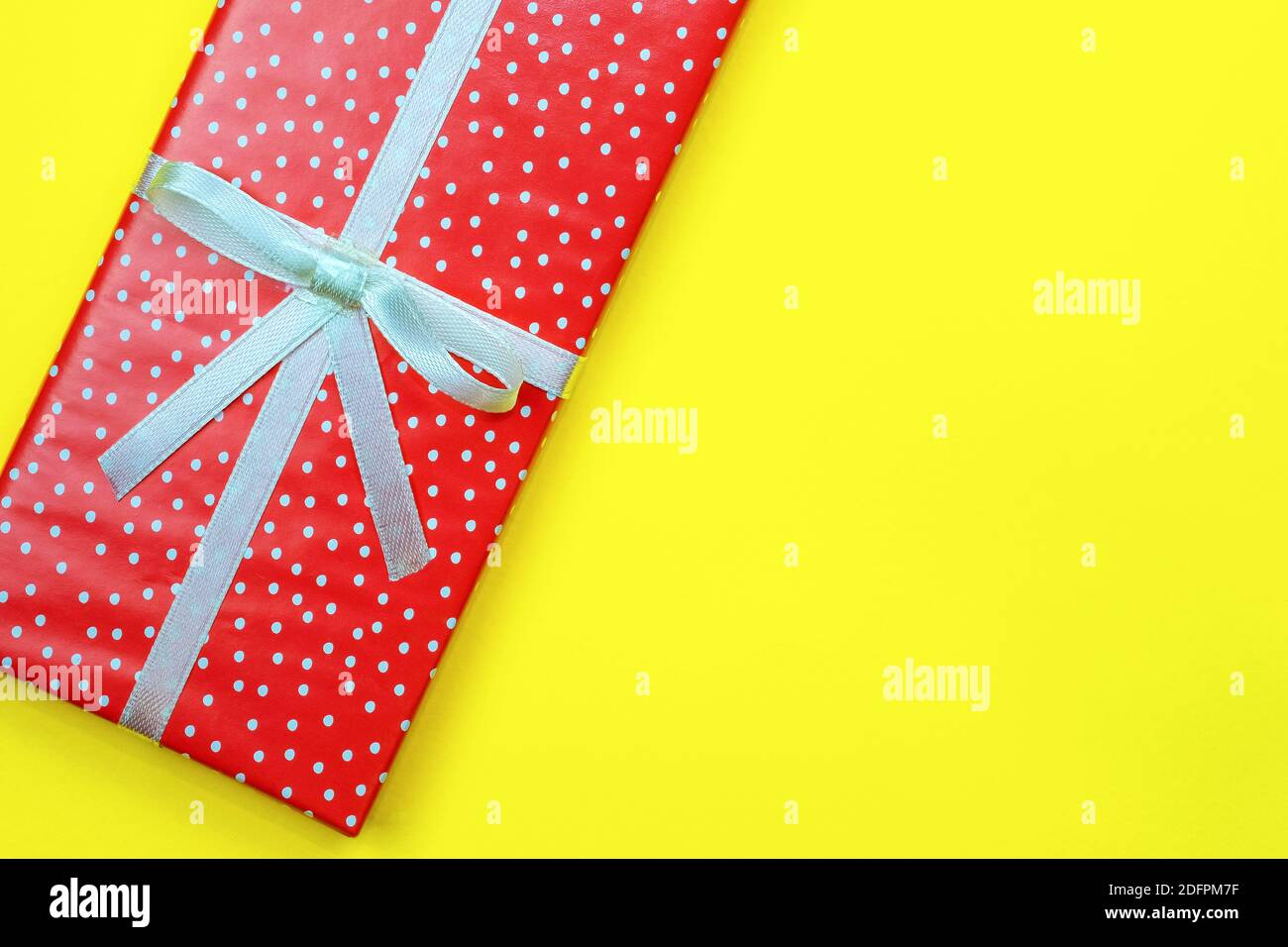 Gift box with copy space. Red rectangular box in a festive wrapping on ...