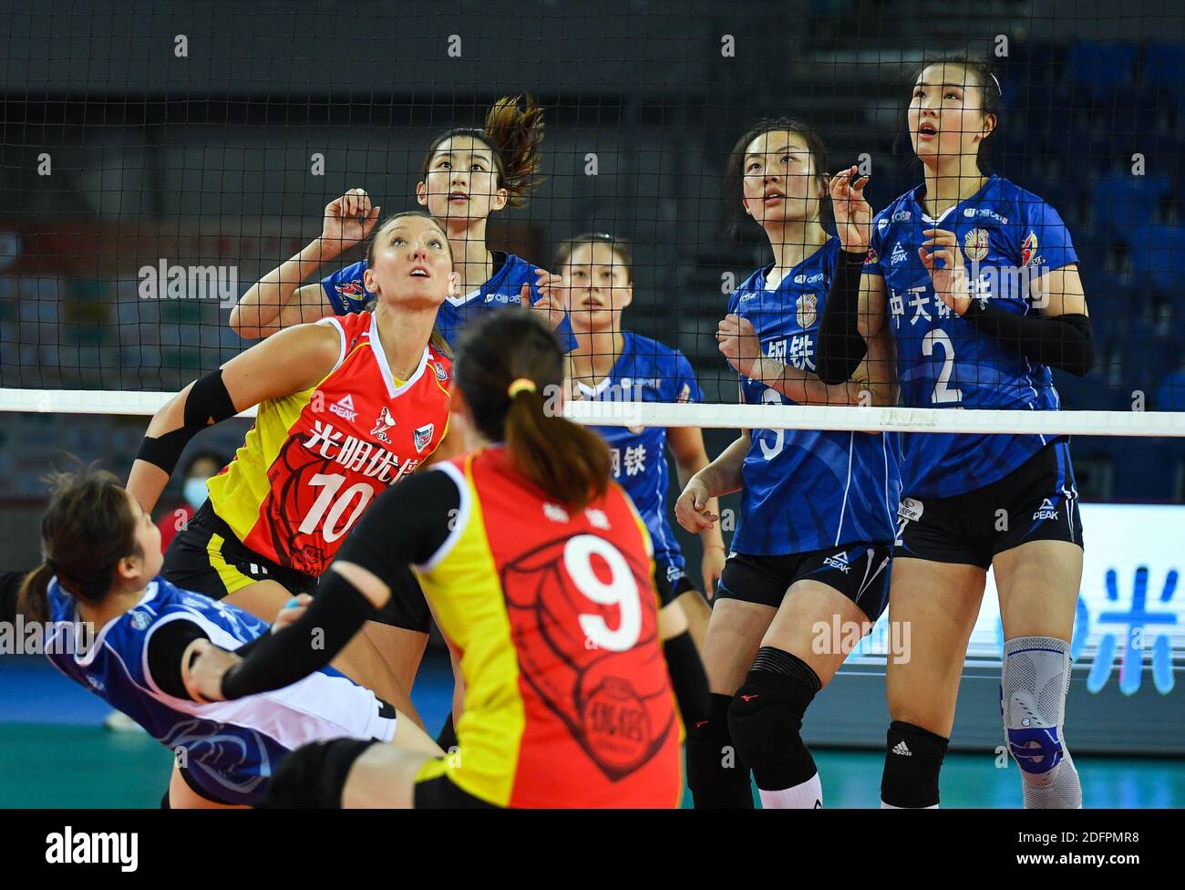 Jiangmen, China's Guangdong Province. 6th Dec, 2020. Players of both sides compete during the Goup D match between Shanghai team and Jiangsu team at the thrid stage of the 2020-2021 season Chinese Women's Volleyball Super League in Jiangmen, south China's Guangdong Province, Dec. 6, 2020. Credit: Liu Dawei/Xinhua/Alamy Live News Stock Photo