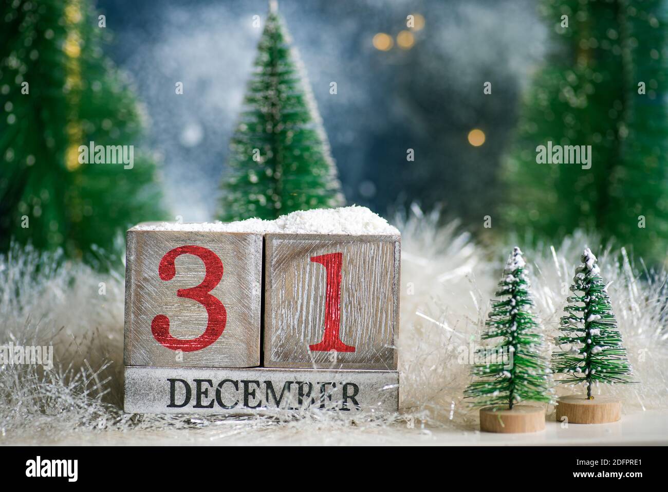 31st December sign for New Year's eve and Christmas tree winter holiday festive background and ornaments Stock Photo