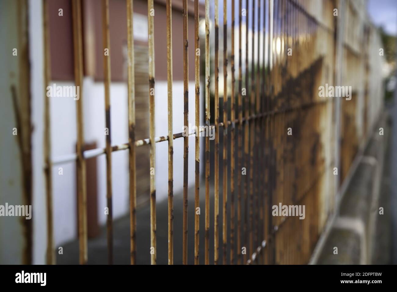 Deteriorated protective rusty fence, construction and architecture, industry Stock Photo