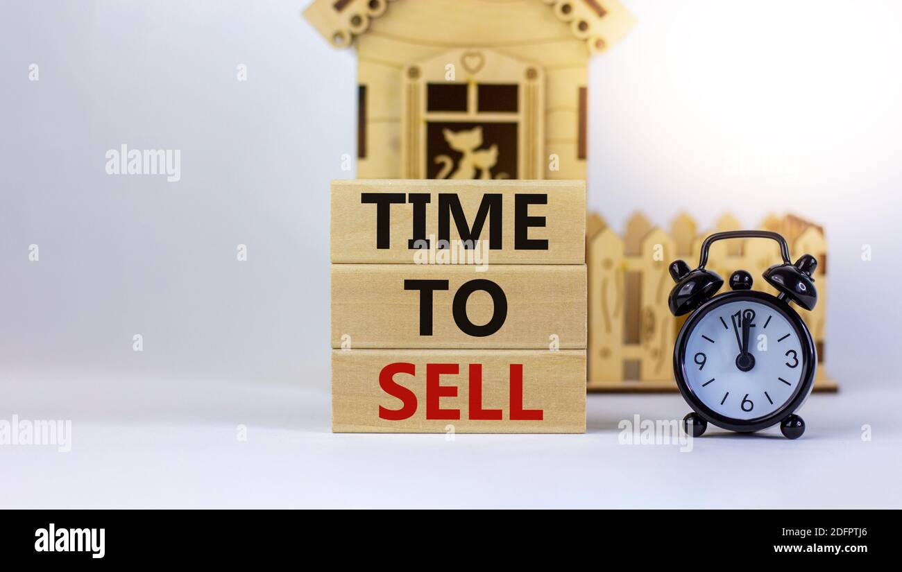 Time to sell real estate. Wooden blocks form the words 'time to sell