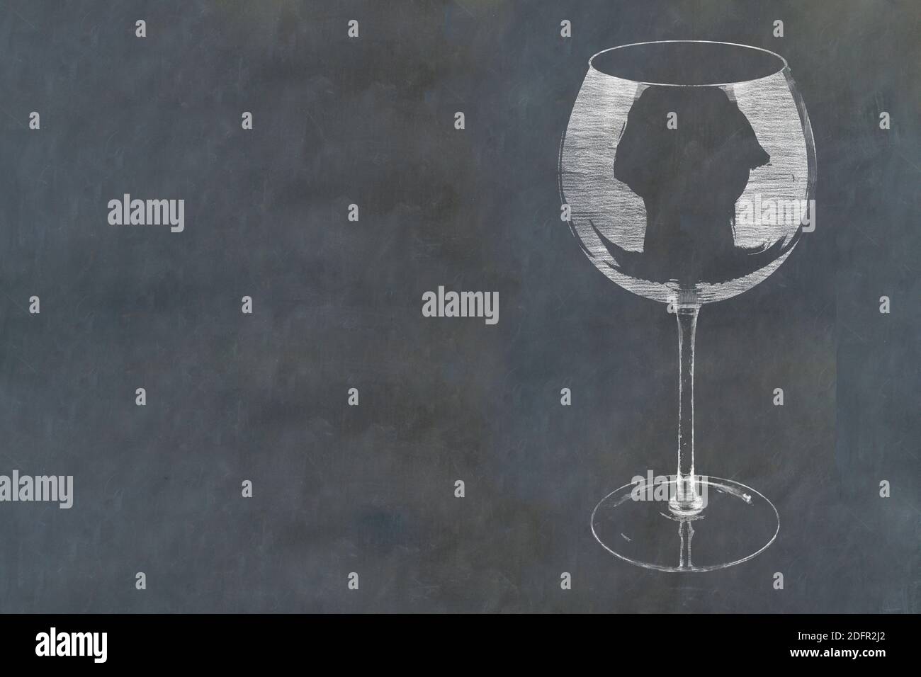 Chalk sketch of wine glass outline on slate blackboard. Stock Photo