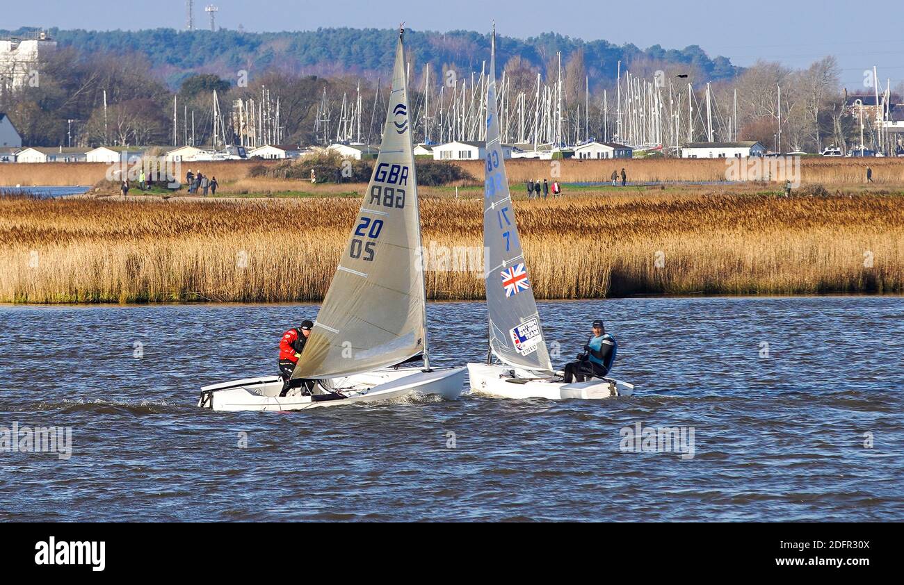 Christchurch, UK. 6th December 2020.  Dinghy sailors make the most of beautifully sunny but chilly conditions in Christchurch harbour in Dorset. credit: Richard Crease/Alamy Live News Stock Photo