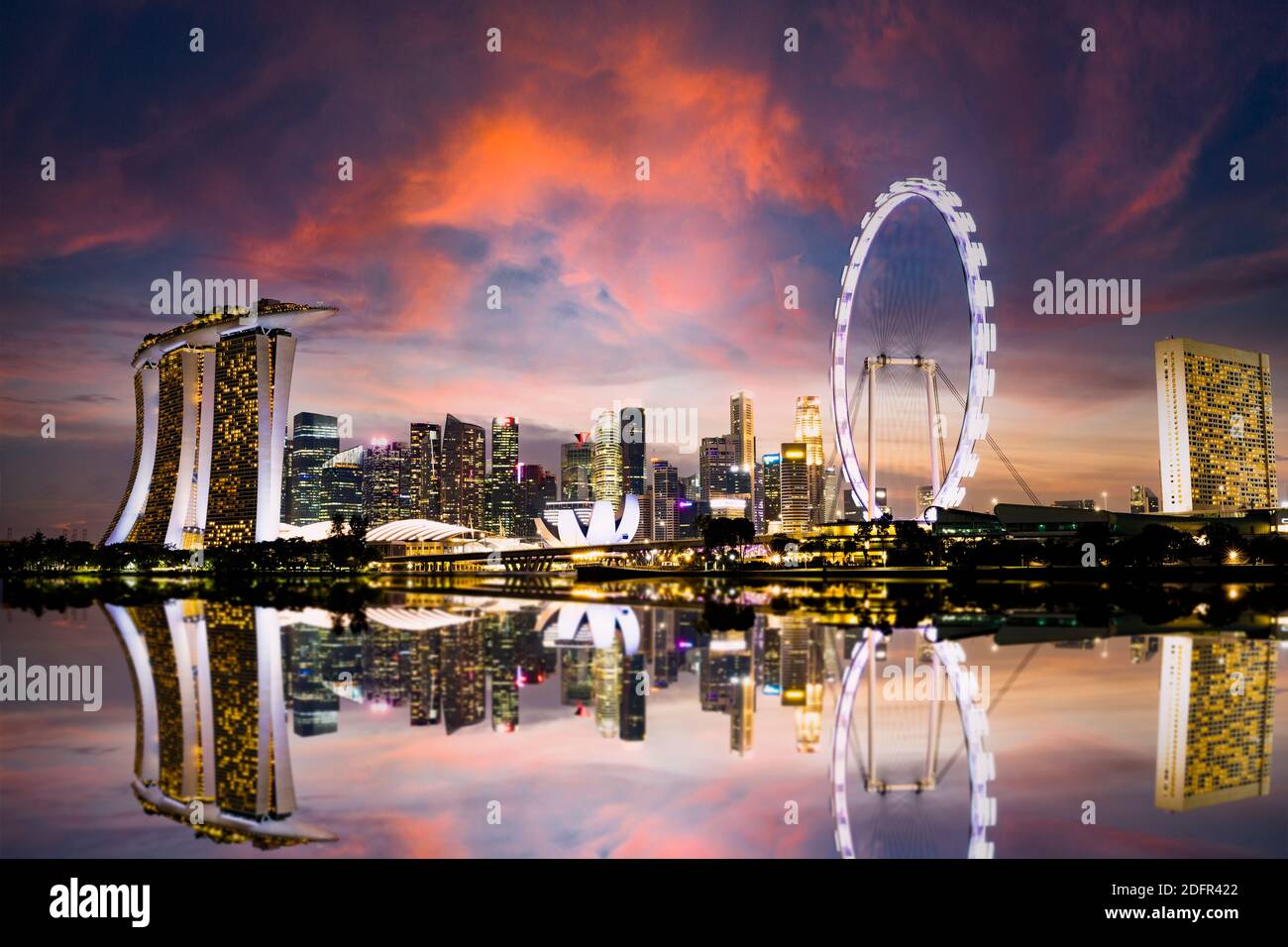 Stunning view of the Singapore's skyline during a beautiful and dramatic sunset.  Singapore is a sovereign island city-state in Southeast Asia. Stock Photo
