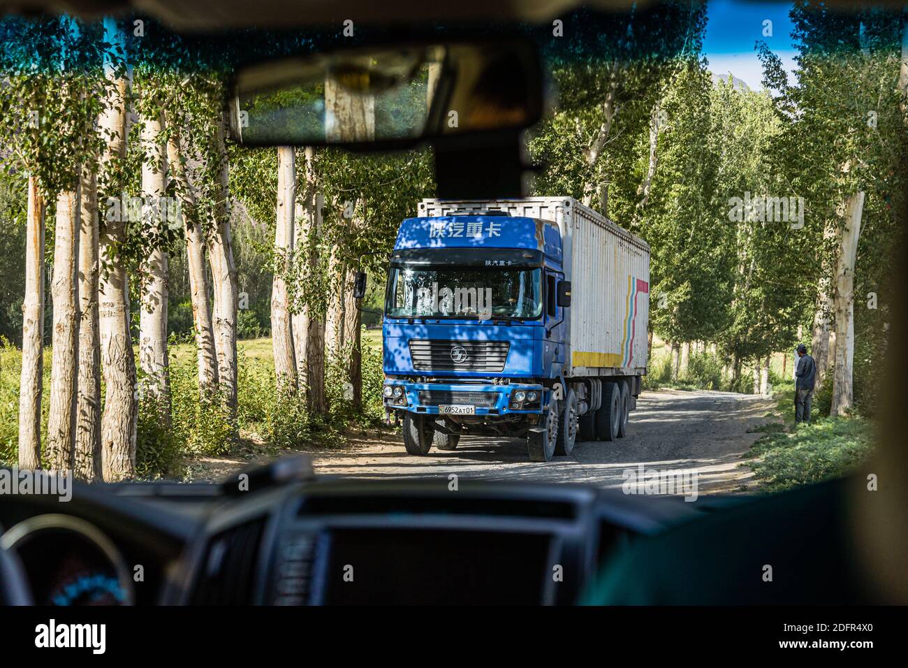Chinese truck with Tajik license plate on the Silk Road in Boibar, Tajikistan Stock Photo