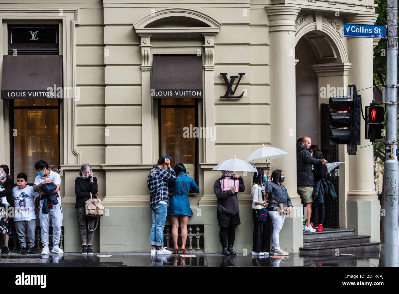 People seen lining up outside Louis Vuitton store in the rain on Collins  Street Stock Photo - Alamy