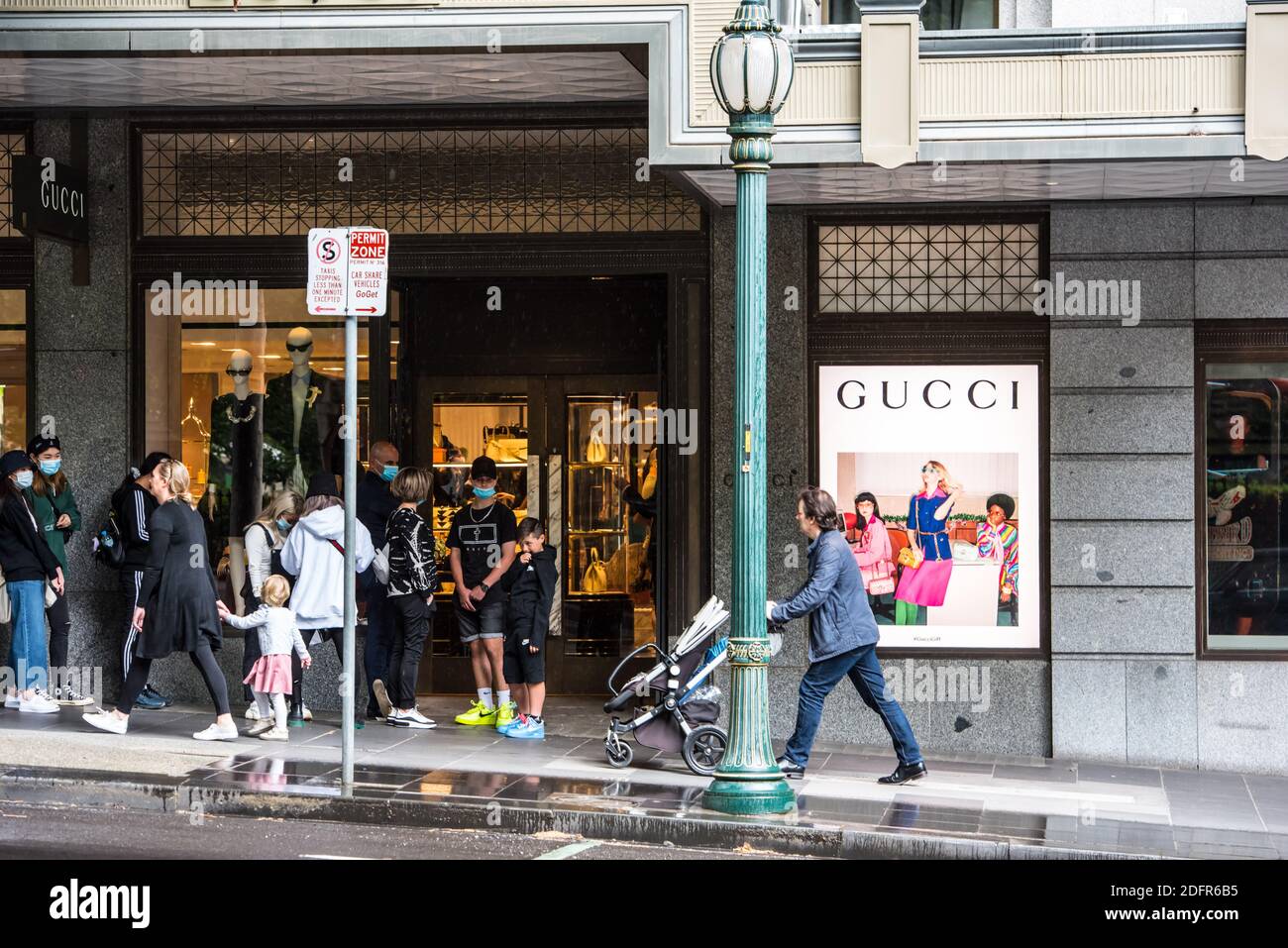 People seen lining up outside Gucci store on in Melbourne CBD Stock Photo - Alamy