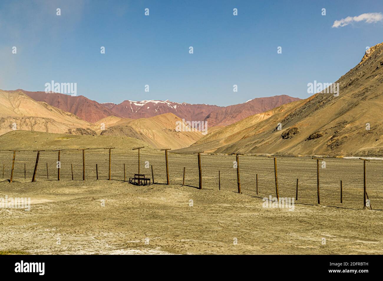 Border fence between China and Tajikistan Stock Photo